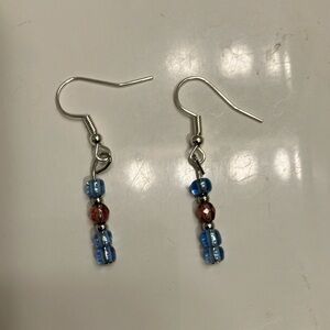 Blue and purple iridescent beads with crystals and silver accents earrings.